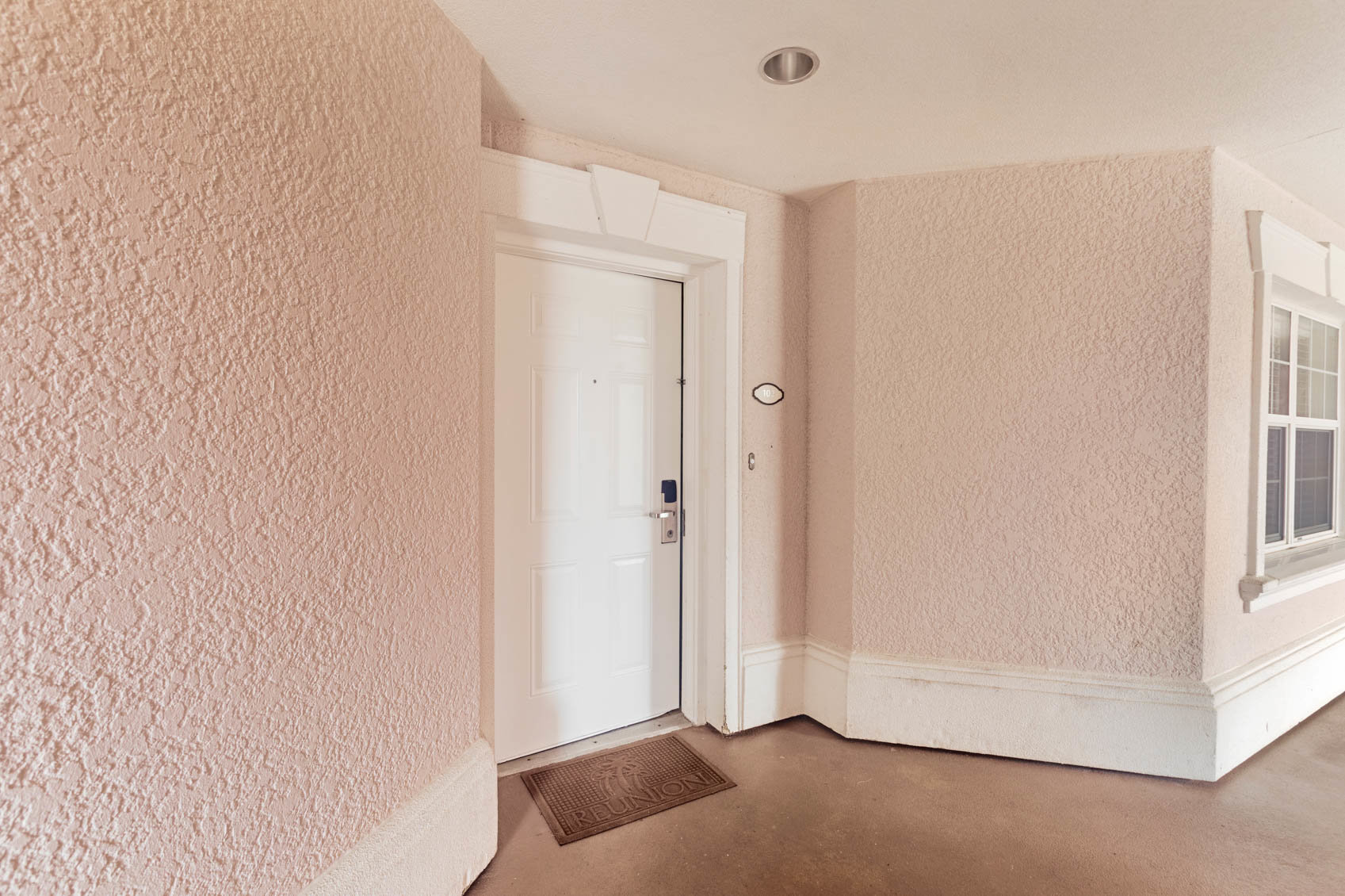 outside front door with pink paint